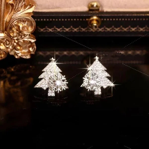 Pendientes giratorios de árbol de Navidad con copos de nieve